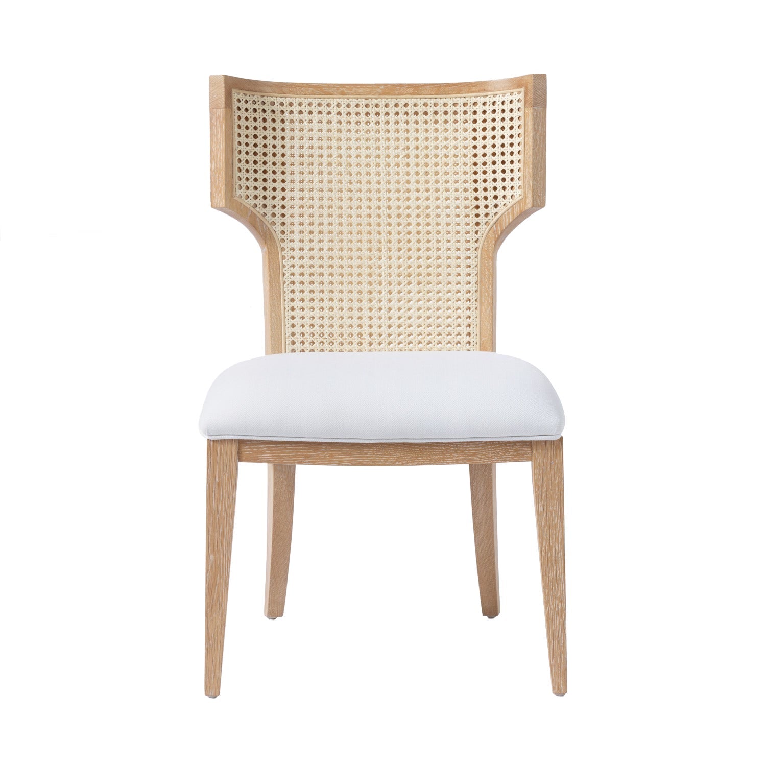 Wooden "Made Goods Carleen" wingback dining chair with white cushion and cane backrest, isolated on a white background.