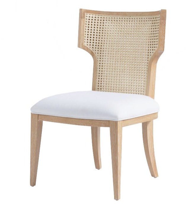 Made Goods Carleen Dining Chair with a white cushioned seat and cane backrest.