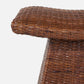 Close-up of the Connie Foot Stool by Made Goods, featuring a lightweight, stylish woven rattan design with a flat rectangular top and angled base, shown against a plain white background.