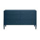The Conrad Dresser Collection by Made Goods features a dark blue six-drawer dresser with small round knobs, tapered legs, and a faux raffia finish, adding luxury style to any space.