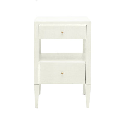 The Conrad Nightstand Collection by Made Goods features wood drawers, a central open shelf, small round gold knobs, and elegant faux raffia wrapping.