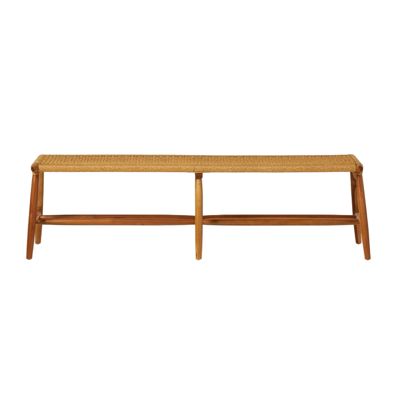 The Corenne Bench by Made Goods features a handcrafted teak frame, loomed fiber rattan seat, four legs, and a minimalist Scandinavian design.