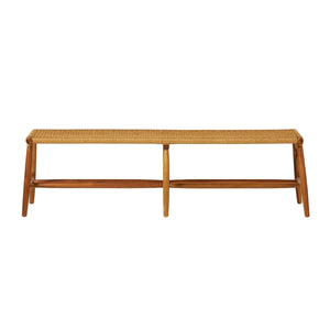 The Corenne Bench by Made Goods features a handcrafted teak frame, loomed fiber rattan seat, four legs, and a minimalist Scandinavian design.