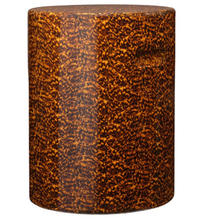The Elton Stool by Made Goods is a cylindrical brown side table with a high-gloss, mottled faux tortoise shell pattern and an inset handle.