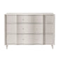 The Essery Dresser Collection by Made Goods features a white six-drawer dresser with a scalloped front and custom hardware inspired by the brand’s signature design.