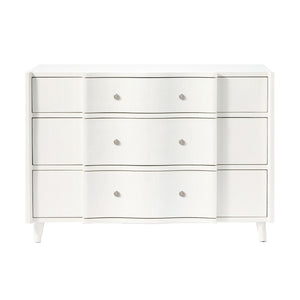 The Essery Dresser Collection by Made Goods features a white three-drawer dresser with a curved front middle section, six round knobs, soft-close glides, and four short legs.