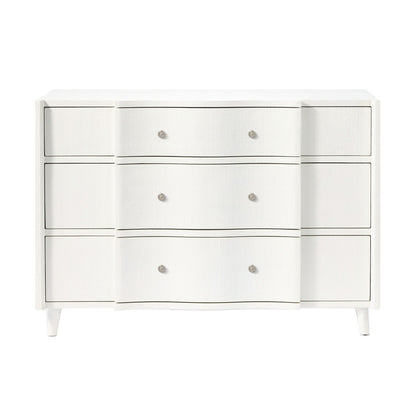 The Essery Dresser Collection by Made Goods features a white three-drawer dresser with a curved front middle section, six round knobs, soft-close glides, and four short legs.