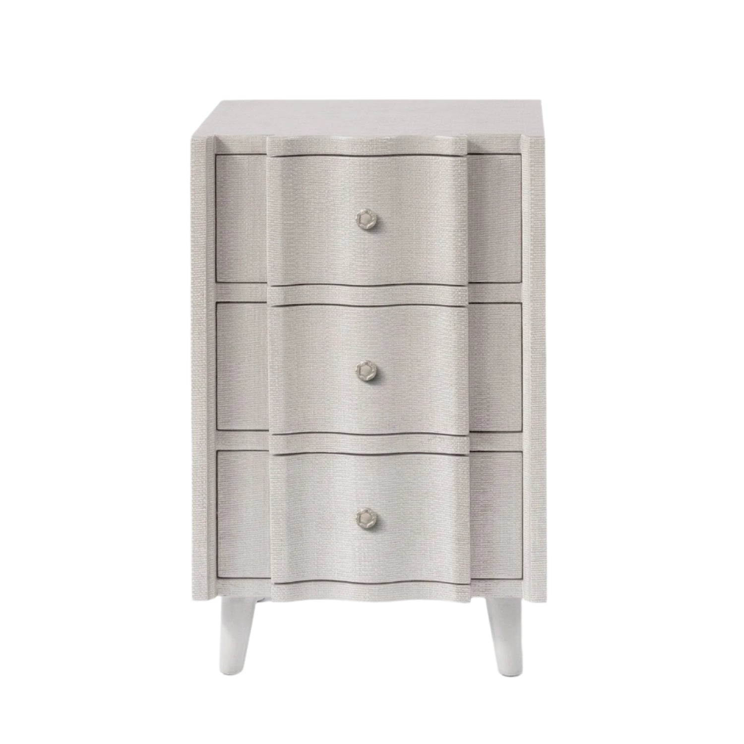 Front view of a light gray, three-drawer nightstand from the Essery Nightstand Collection by Made Goods, featuring faux raffia texture, round knobs, and tapered legs—a stylish transitional accent for any room.