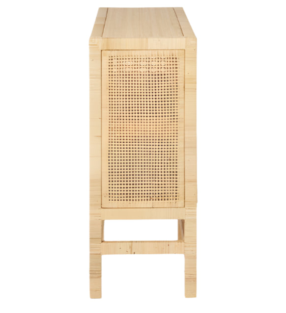 Side view of the Isla Narrow Buffet by Made Goods, featuring light wood, rattan-cane doors, and four straight legs, set against a white background.
