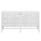 The Isla Narrow Buffet by Made Goods is a white wooden sideboard with rattan-cane doors, gold knobs, and four sturdy legs.