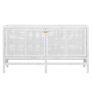 The Isla Narrow Buffet by Made Goods is a white wooden sideboard with rattan-cane doors, gold knobs, and four sturdy legs.