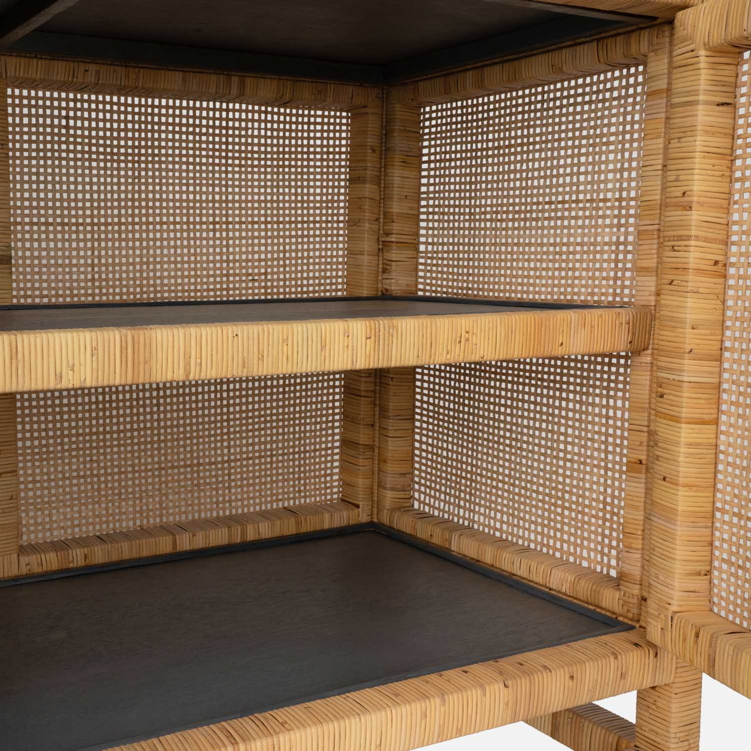 Close-up of the Made Goods Isla 3 Door Buffet, featuring woven cane sides and two wooden shelves—highlighting its detailed texture and craftsmanship, ideal as a stylish sideboard for your dining room essentials.