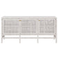 The Isla 3 Door Buffet by Made Goods is a white wooden sideboard with rattan-cane doors, minimal gold knobs, and short legs—ideal for storing your dining room essentials.