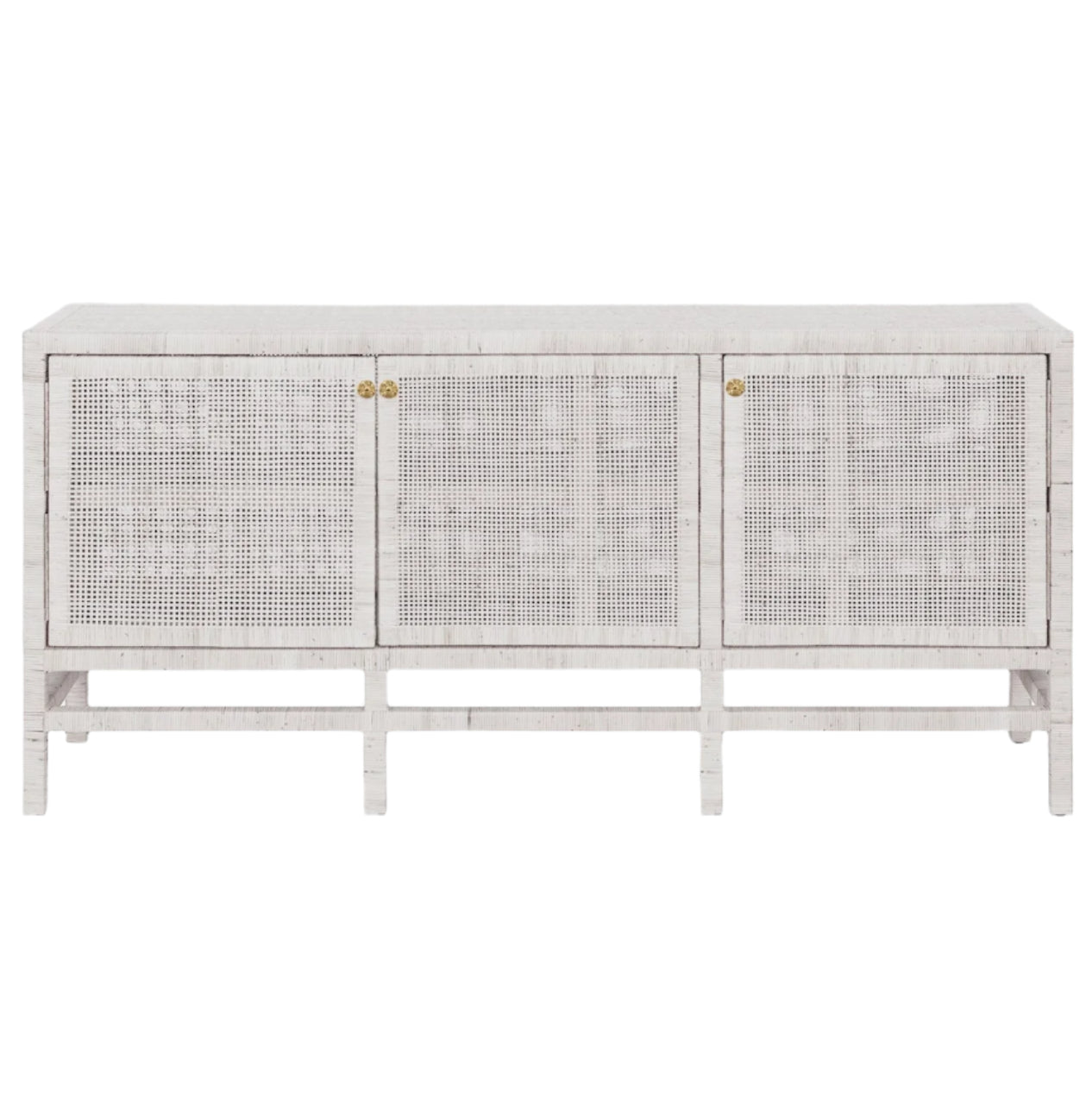 The Isla 3 Door Buffet by Made Goods is a white wooden sideboard with rattan-cane doors, minimal gold knobs, and short legs—ideal for storing your dining room essentials.