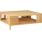 The Isla Coffee Table by Made Goods is a square, light-colored rattan piece featuring open shelving on each side, a lower storage shelf, and short legs.