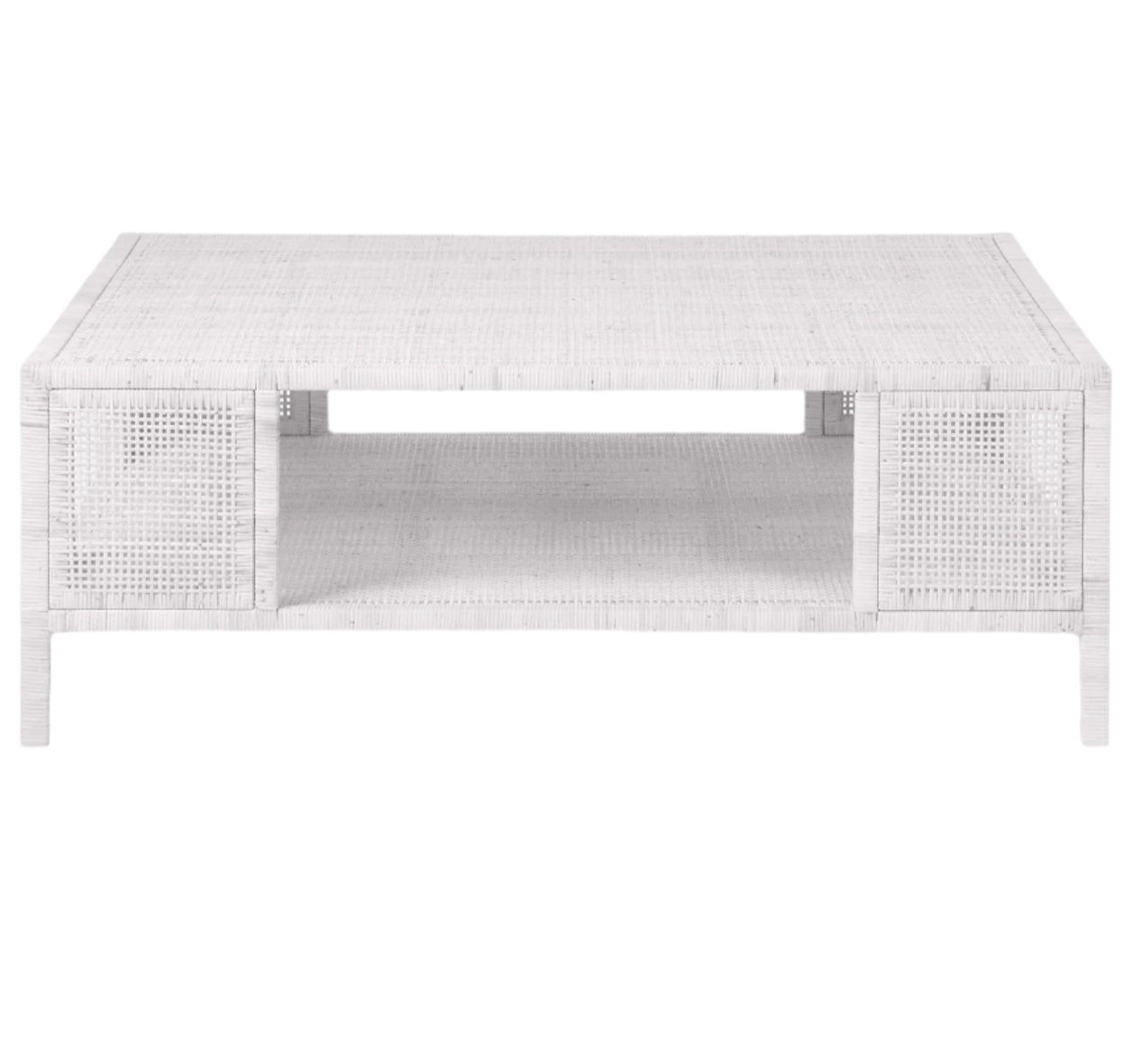 The Isla Coffee Table by Made Goods features a rectangular white rattan design with an open lower shelf, displayed against a plain white background.