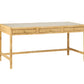 The Isla Desk by Made Goods features a light-finished rectangular wooden tabletop, three soft-close drawers, and an elegant rattan frame for a refined touch.