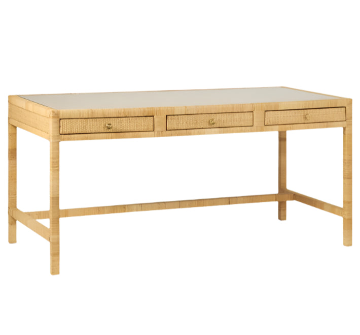The Isla Desk by Made Goods features a light-finished rectangular wooden tabletop, three soft-close drawers, and an elegant rattan frame for a refined touch.