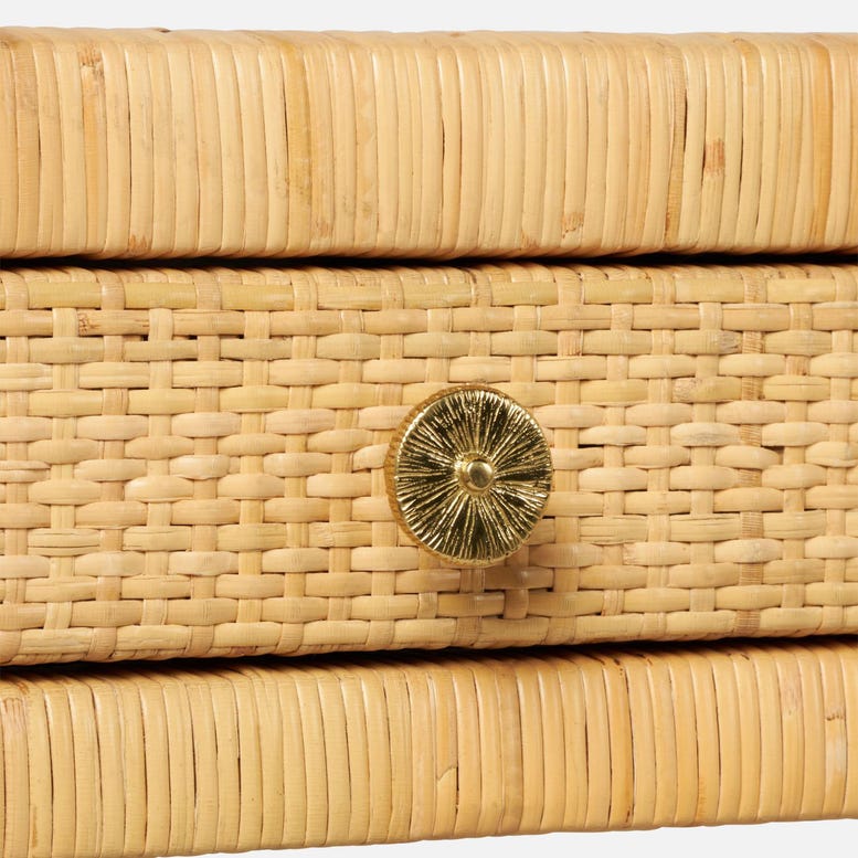 Close-up of the Isla Desk by Made Goods, featuring a woven rattan drawer with a basket weave top and a round, textured metallic knob at the center.