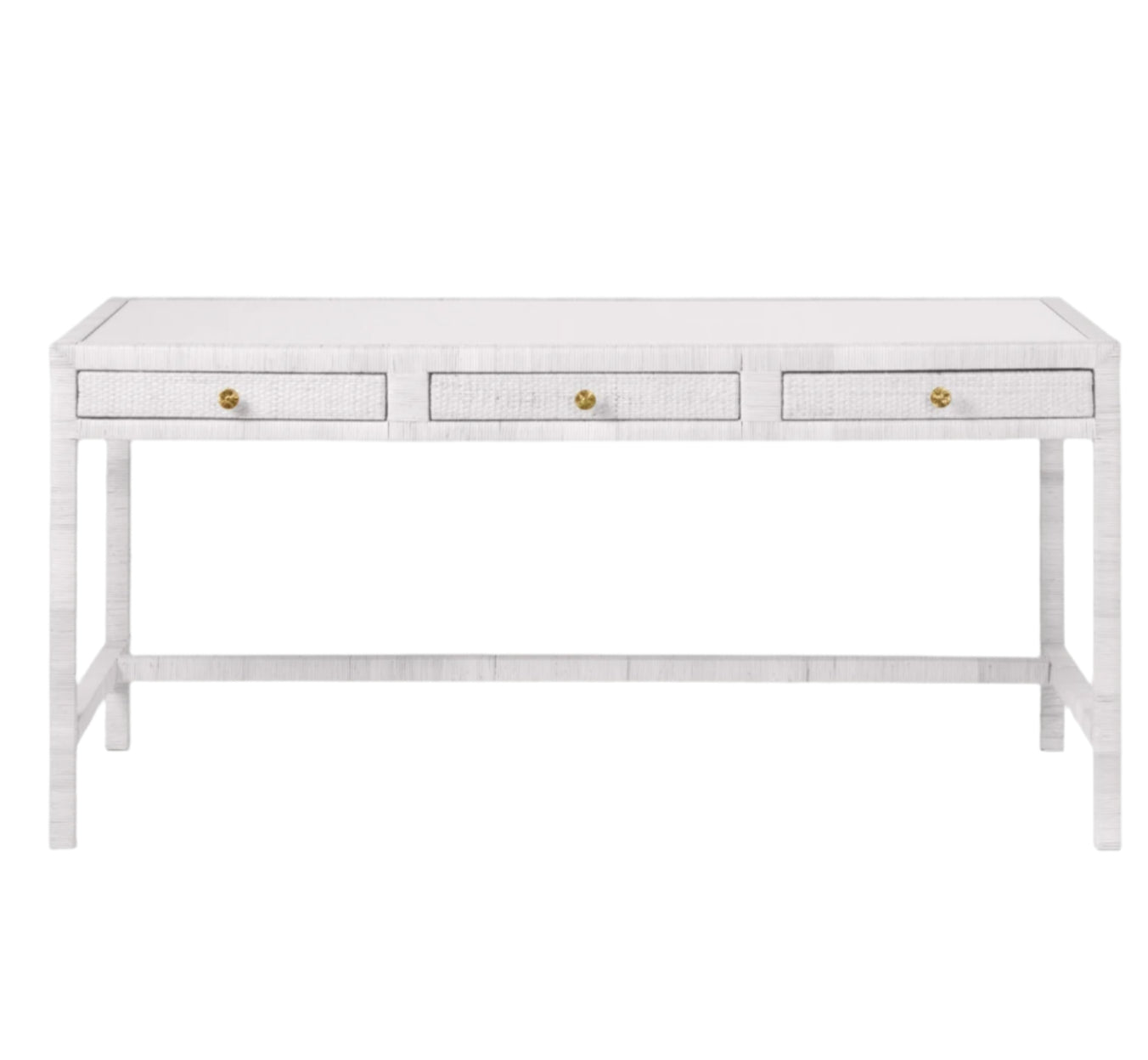 The Isla Desk by Made Goods is a rectangular white desk with three front drawers, each with a small round gold knob, and simple straight legs.