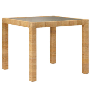 The Isla Game Table by Made Goods is a square wooden rattan table with a simple design, four straight legs, and a flat dark tabletop.