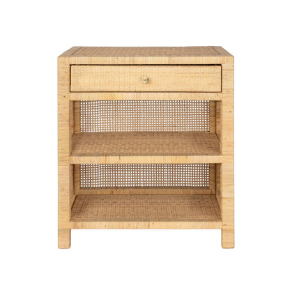 The Isla Nightstand Collection by Made Goods features a rectangular rattan frame, woven cane sides and back, a soft-close top drawer, and two open shelves.