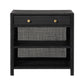 The Isla Nightstand Collection by Made Goods features a black wicker nightstand with a rattan frame, one drawer with two gold knobs, and two open shelves below.