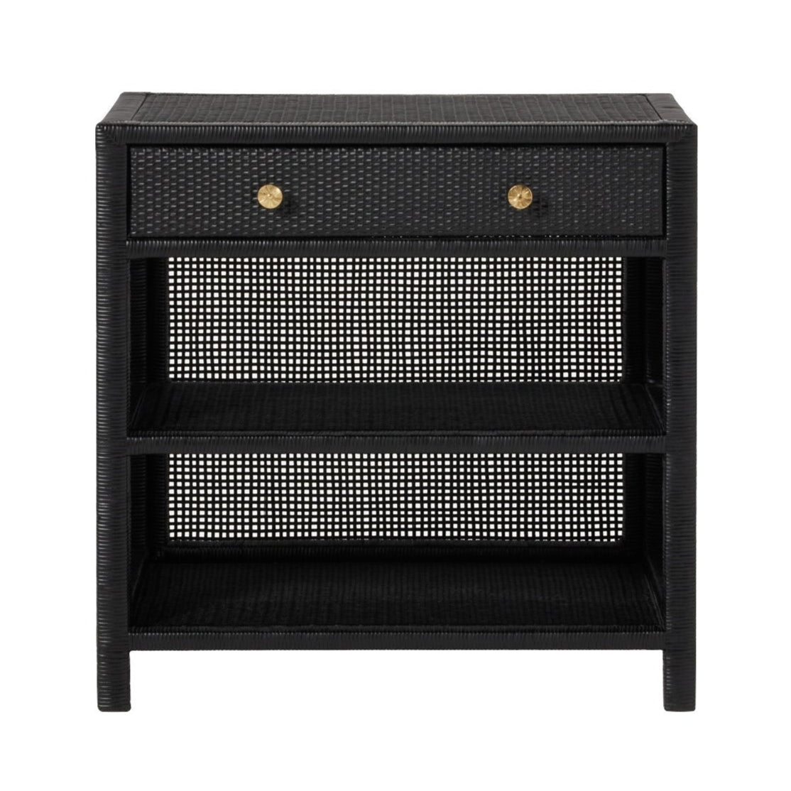 The Isla Nightstand Collection by Made Goods features a black wicker nightstand with a rattan frame, one drawer with two gold knobs, and two open shelves below.