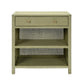 The Made Goods Isla Nightstand Collection features a rectangular light green nightstand with a rattan frame, one soft-close drawer, and two open shelves, shown against a white background.