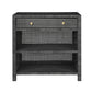 The Isla Nightstand Collection by Made Goods features a dark gray woven nightstand with a soft-close drawer with two round knobs and two open shelves below.