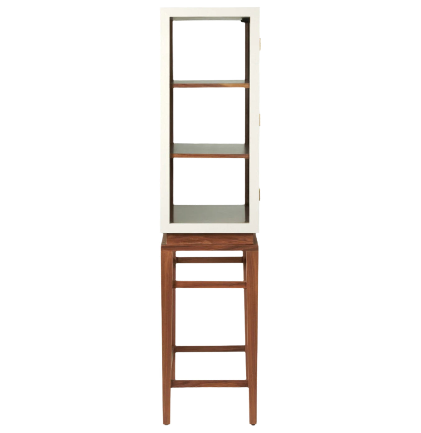 A Made Goods Jamison Cabinet with glass panels, two shelves, and elegant walnut legs stands on a tall wooden stool.
