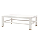 The Jarin Coffee Table in Designer White by Made Goods features simple, clean lines, short legs with metallic caps, and is crafted from faux Belgian linen for elegant texture.