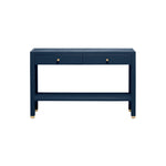 The Jarin Console Collection by Made Goods showcases a navy blue finish in faux Belgian linen, with two drawers, gold knob handles, a lower shelf, and gold-capped feet, photographed against a white background.