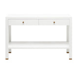 The Jarin Console Collection by Made Goods features a white wooden desk with a simple silhouette, two drawers with brass-hued knobs, textured finish, open lower shelf, and brass-accented feet, shown against a white background.