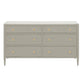 The Jarin Dresser Collection by Made Goods is a gray linen six-drawer dresser with gold round knobs, tapered legs, and quality craftsmanship. Shown against a white background.