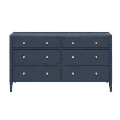 The Jarin Dresser Collection by Made Goods features a navy blue six-drawer linen dresser with gold round knobs, tapered legs, and smooth European glides, shown front-facing against a white background.