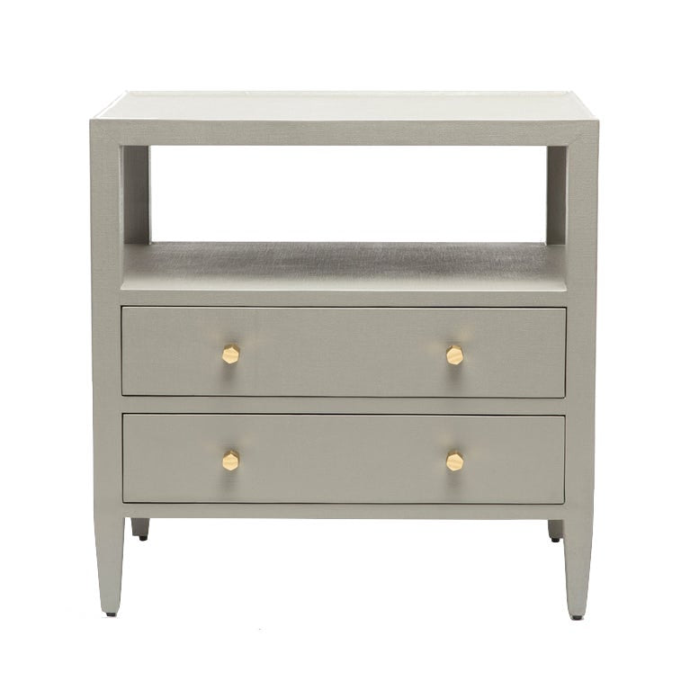 The Jarin Nightstand Collection by Made Goods features a light gray linen finish, two drawers with gold round knobs, European glides, an open shelf above the drawers, and four tapered legs.