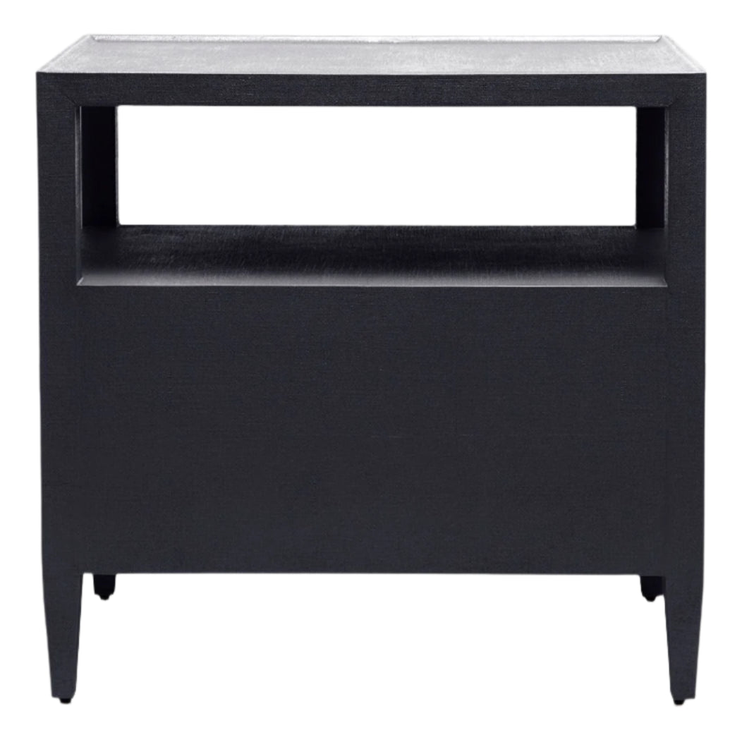 The Jarin Nightstand by Made Goods is a black rectangular wooden side table with an open shelf below the tabletop and four straight legs, crafted with quality workmanship.