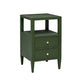 The Jarin Nightstand Collection by Made Goods features a dark green nightstand with two drawers on European glides, gold knobs, tapered legs, and an open upper shelf, displayed against a white background.