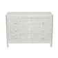 The Lexi Dresser by Made Goods is a gray and white piece with three drawers, featuring an intricate Indian floral and leaf camel bone inlay on the front, sides, and top.
