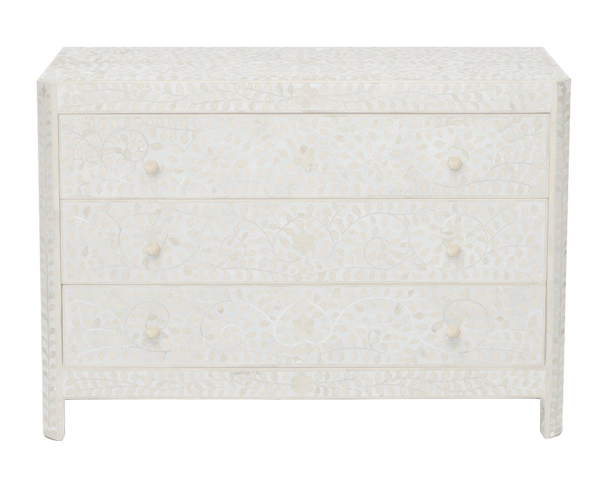 The Lexi Dresser by Made Goods showcases an Indian-inspired white floral inlay pattern with round knobs and elegant camel bone accents, beautifully crafted and viewed from the front.