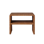 The Lynette Side Table in Dark Rattan by Made Goods features a rectangular silhouette with a Lynette-inspired woven facade, rounded edges, and an open lower shelf, shown against a plain white background.