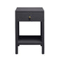 The Maris Nightstand Collection by Made Goods features a black wooden nightstand with raised feet, a single drawer with a round gold knob and overlay panels, and an open shelf below, displayed against a white background.