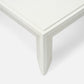 Close-up of the corner and leg of the Made Goods Roberts Coffee Table, featuring clean, angular lines and uniquely shaped legs that showcase its sophisticated style against a white background.