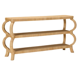 Made Goods’ Tottie Console is a three-tiered table with curved legs, open shelving, a natural light wood finish, and Southeast Asia-inspired peeled rattan accents.