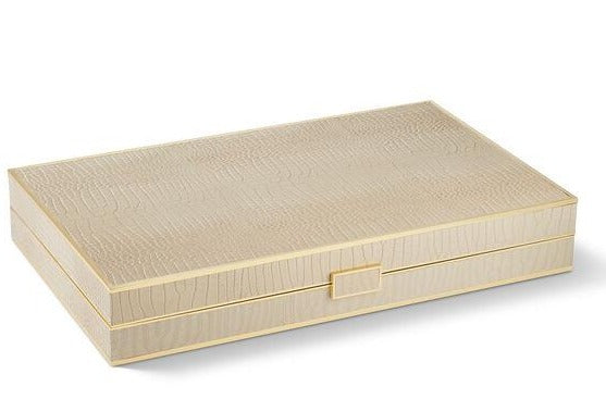 The Aerin Croc Leather Backgammon Set features a rectangular beige box with a subtle crocodile finish and a small square clasp, shown on a white background.