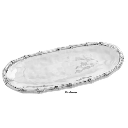 Introducing the Beatriz Ball Garden Bamboo Oval Tray from Beatriz Ball, crafted in aluminum alloy, featuring a bamboo-patterned rim. This "Medium" silver serving dish adds sophistication to any table setting.