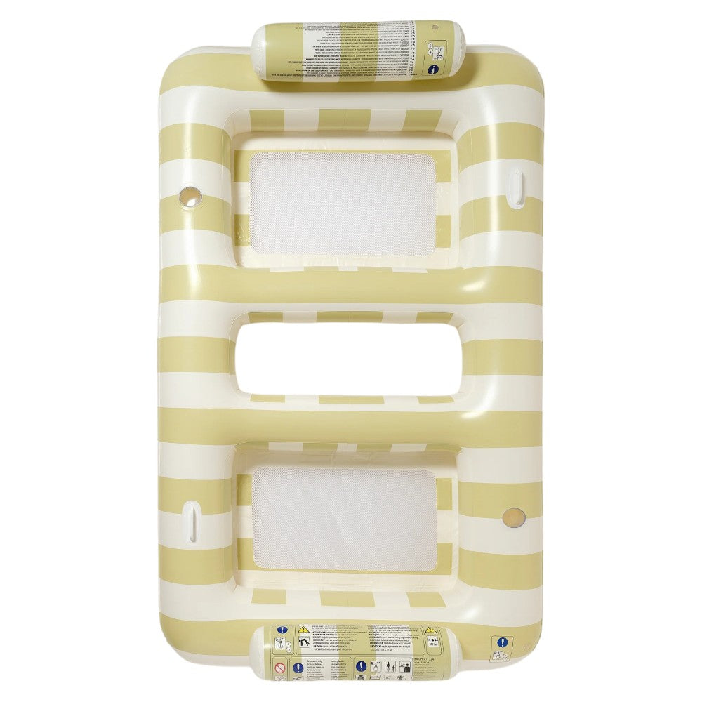 The Luxe Twin Hammock Float Casa Sand Stripe by Sunnylife features beige and white stripes, two mesh seat openings, safety instructions on the sides, and adds a signature Aussie summer vibe to your pool days.