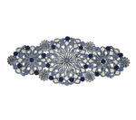 The Kim Seybert Marisol Runner, Blue/Natural, features intricate oval-shaped embroidery with blue, white, and beige floral and circular motifs for artisanal table decor.