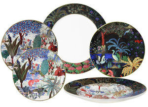 Five plates from the Jardins Du Palais Dinnerware Collection by Gien France, featuring vibrant nature scenes with animals, trees, water, and exotic plants, are displayed overlapping on a white background.
